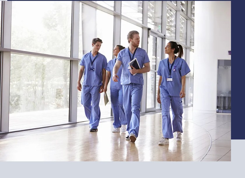 Nurses walking through a hospital corridor